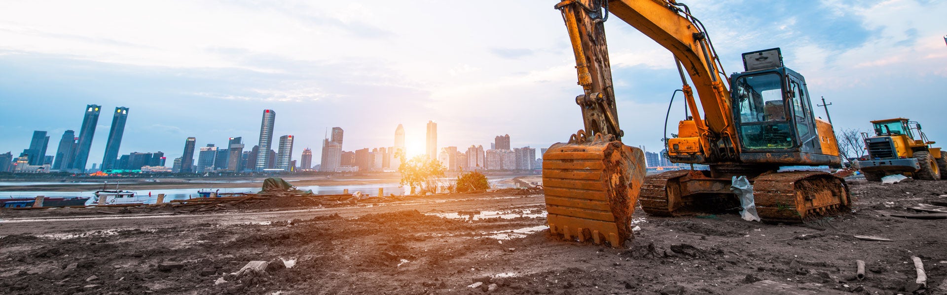 An excavator and loader working on a construction site