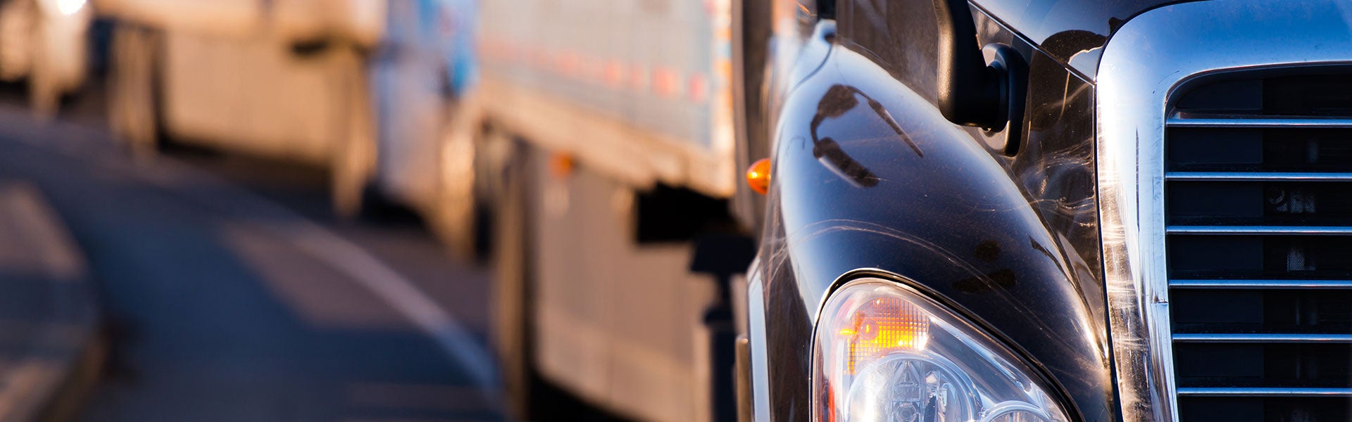 Semi trucks traveling on a highway